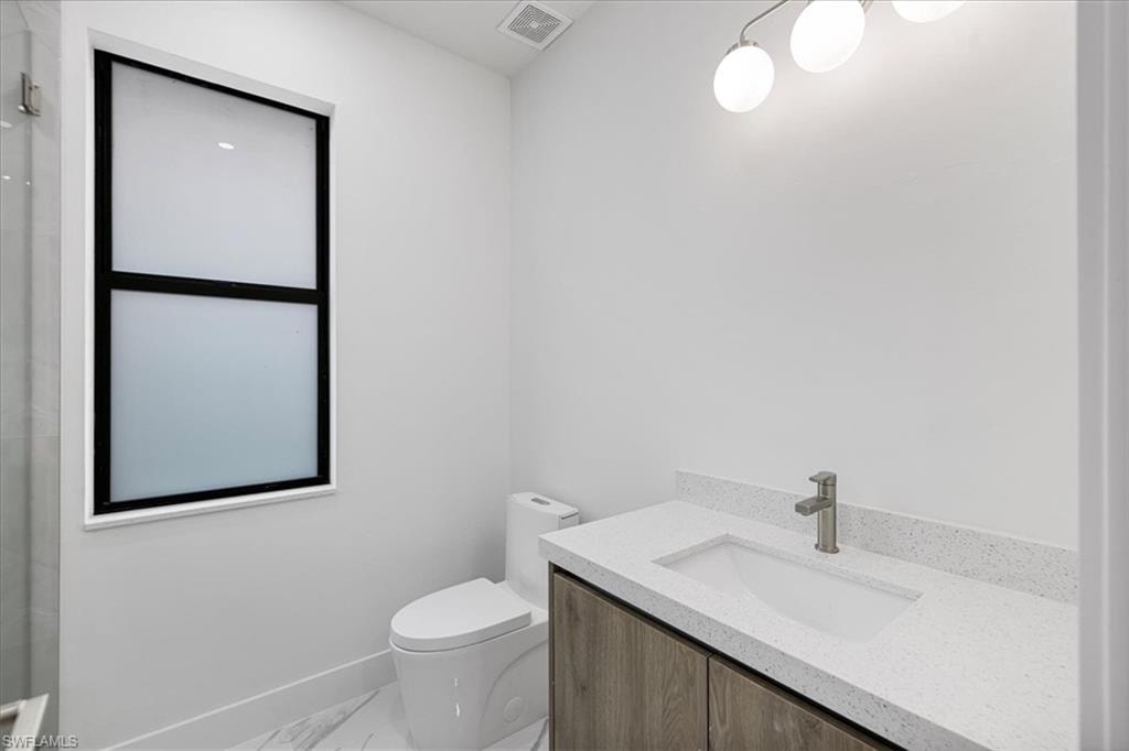 Bathroom with vanity and toilet