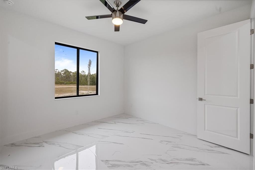 Spare room featuring ceiling fan