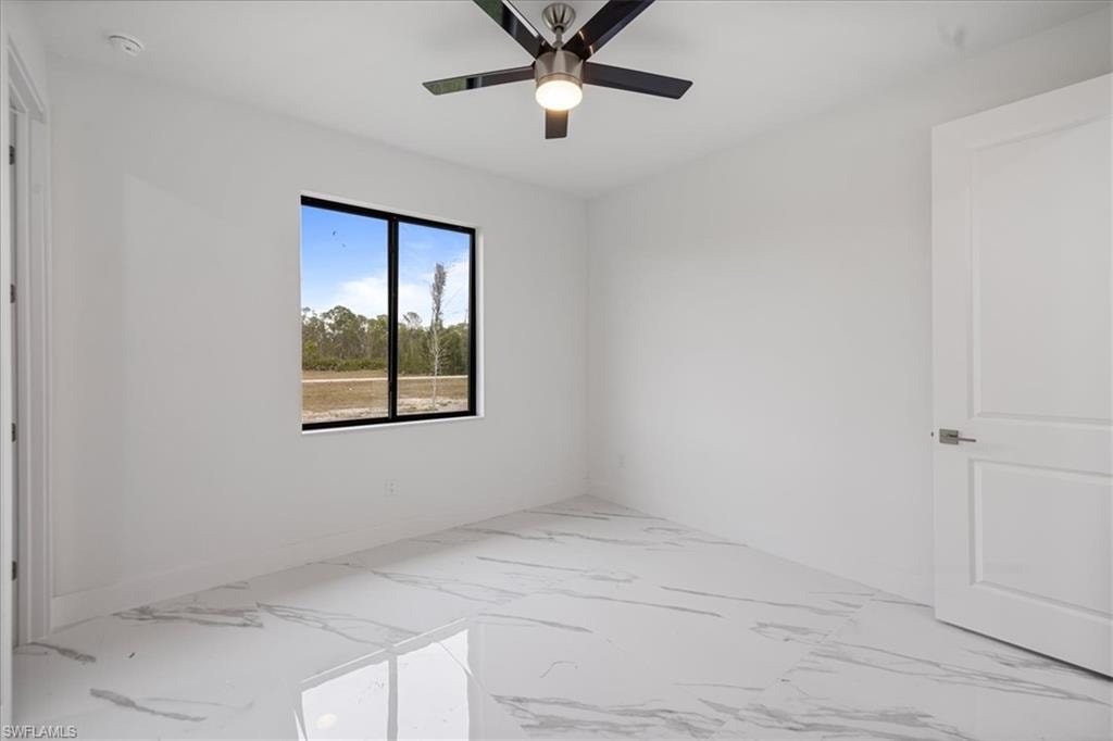 Spare room featuring ceiling fan