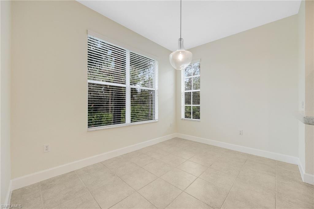 Unfurnished room with light tile patterned floors