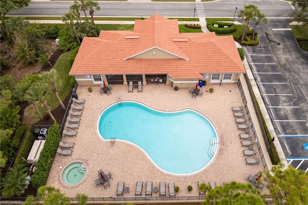 View of pool featuring a patio area and a community hot tub