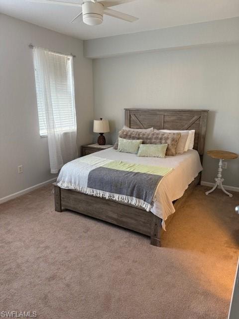 Carpeted bedroom with ceiling fan