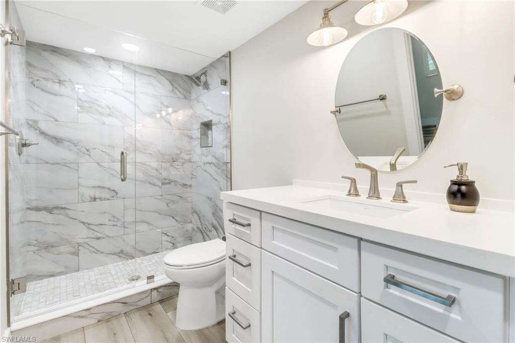 Second primary bathroom featuring a walk-in shower