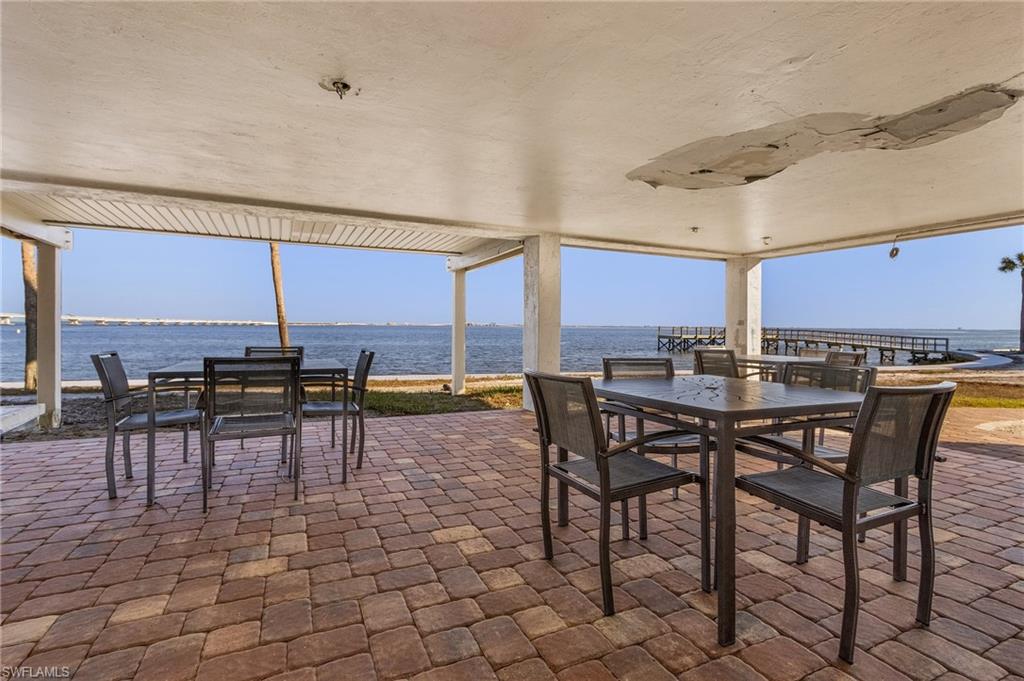 View of patio / terrace featuring a water view