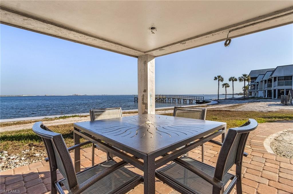 View of patio with a water view
