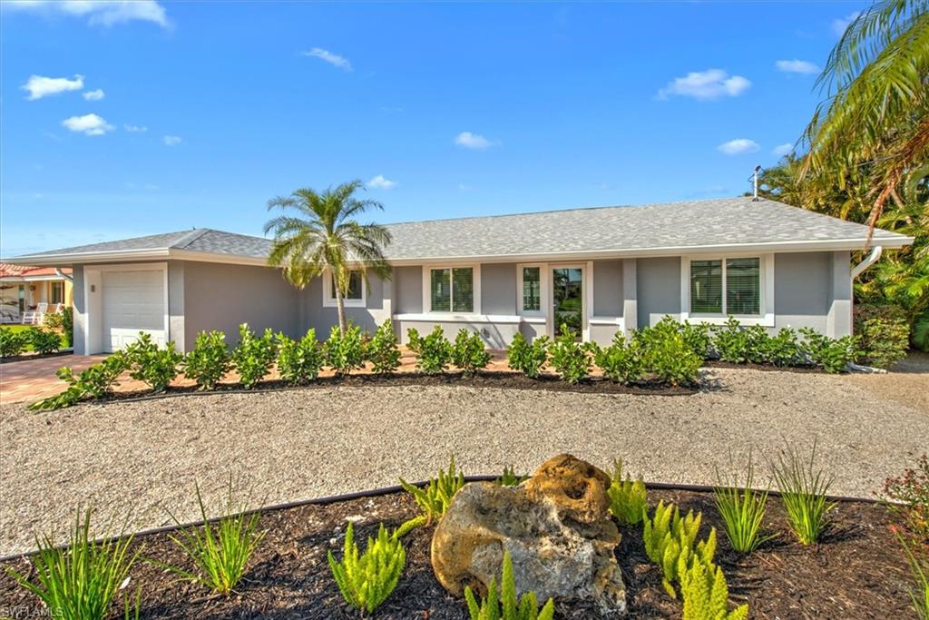 Single story home with a garage