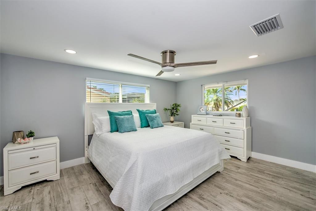 Bedroom featuring ceiling fan and light hardwood / wood-style flooring