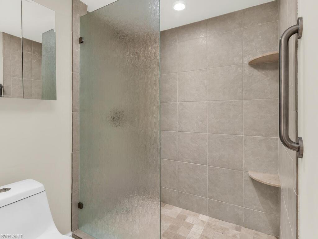 Bathroom featuring toilet and walk in shower