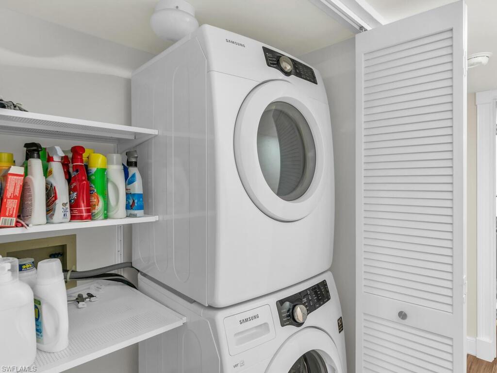 Washroom with stacked washer / drying machine