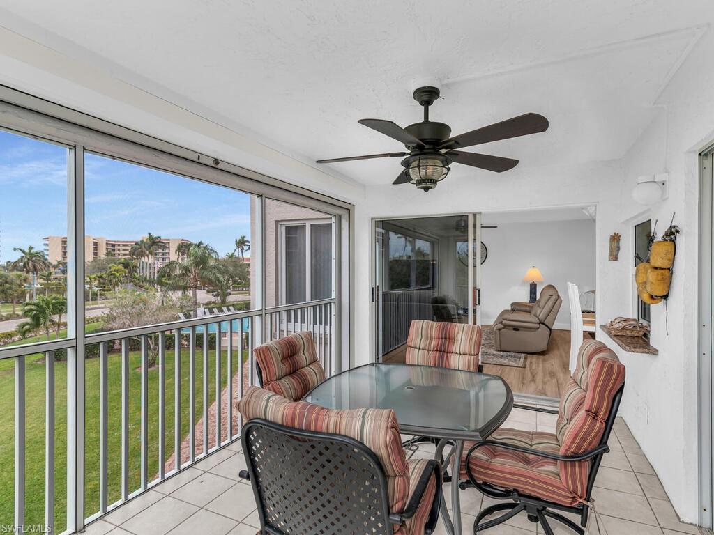 Sunroom featuring ceiling fan