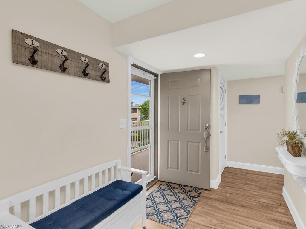 Foyer with light hardwood / wood-style flooring