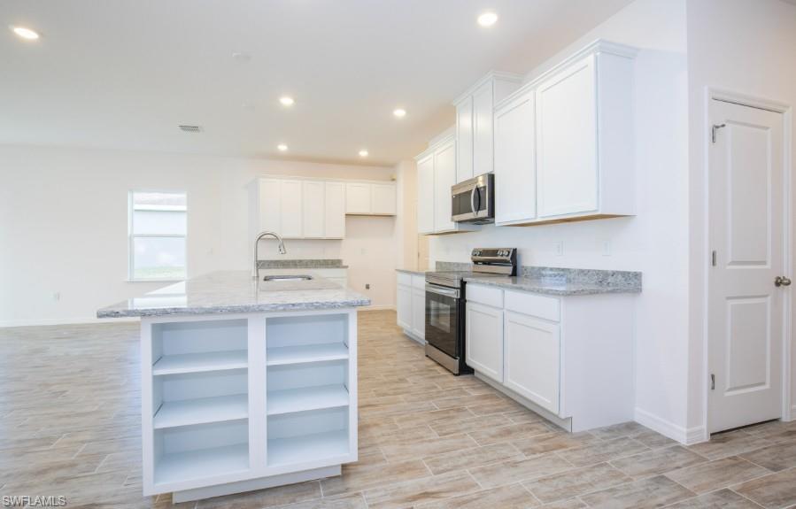 Gorgeous Kitchen -large island, granite countertops, stainless appliances, & spacious cabinets