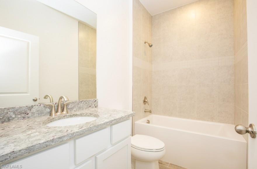 Secondary Bedroom with tile shower/tub combo