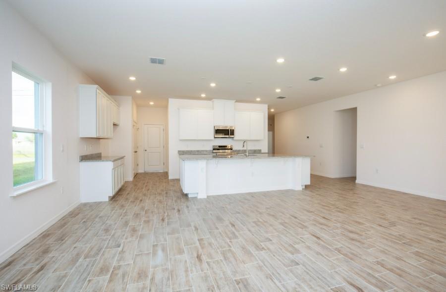 Gorgeous Kitchen -large island, granite countertops, stainless appliances, & spacious cabinets