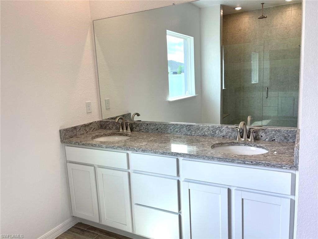Primary Bath - granite countertops with dual vanity