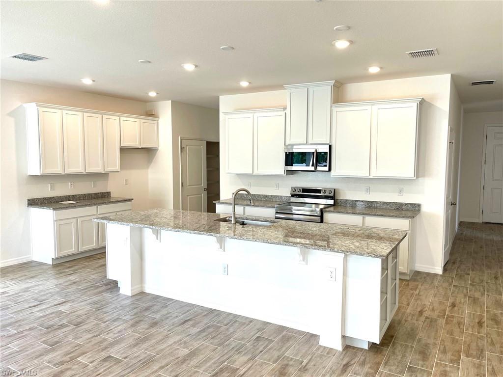 Gorgeous Kitchen -large island, granite countertops, stainless appliances, & spacious cabinets