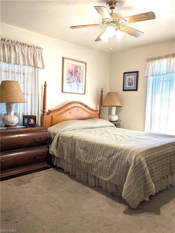 Bedroom featuring carpet floors and ceiling fan