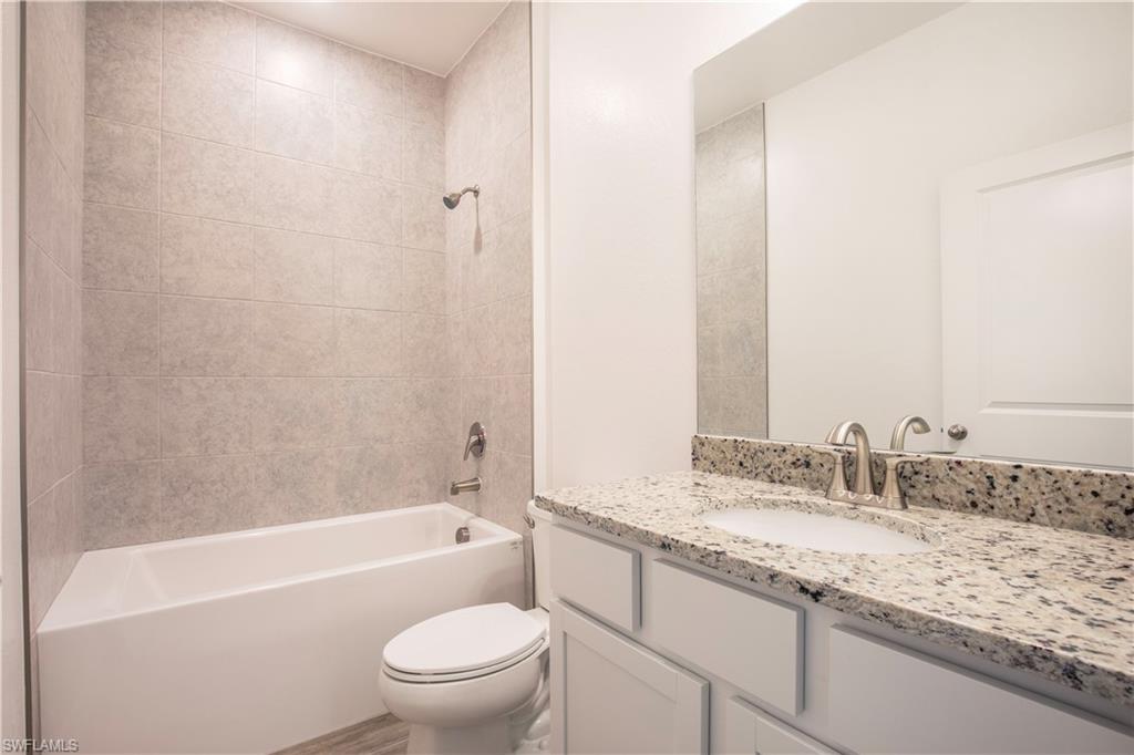 Full bathroom featuring shower / washtub combination and vanity