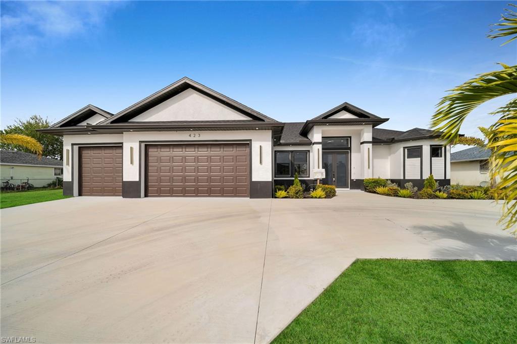 View of front of house with a garage