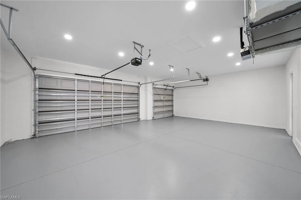 Garage featuring a garage door opener