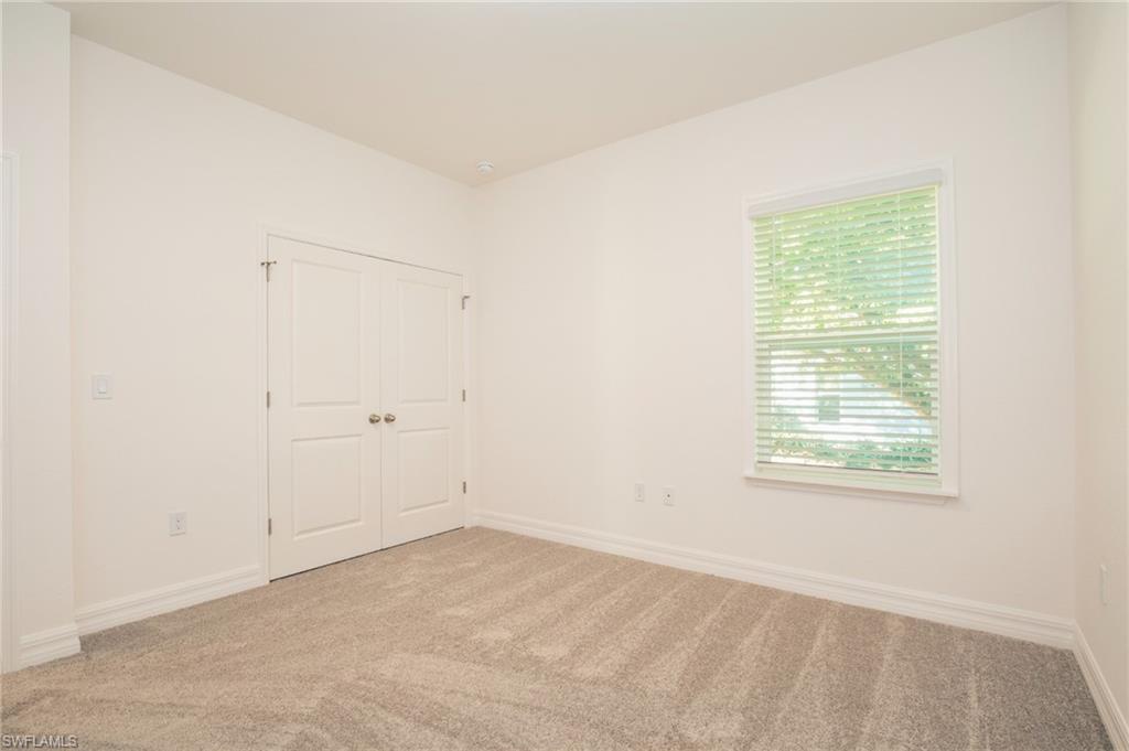 Unfurnished bedroom with carpet floors and a closet