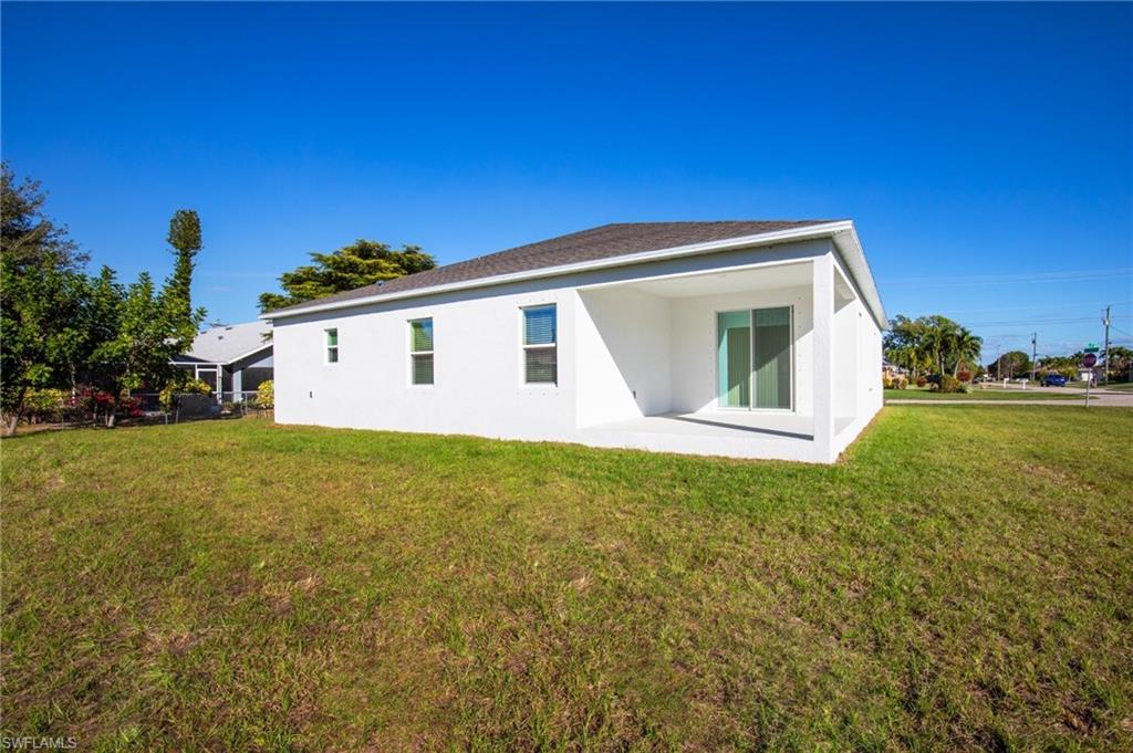 Back of property featuring a patio and stucco siding
