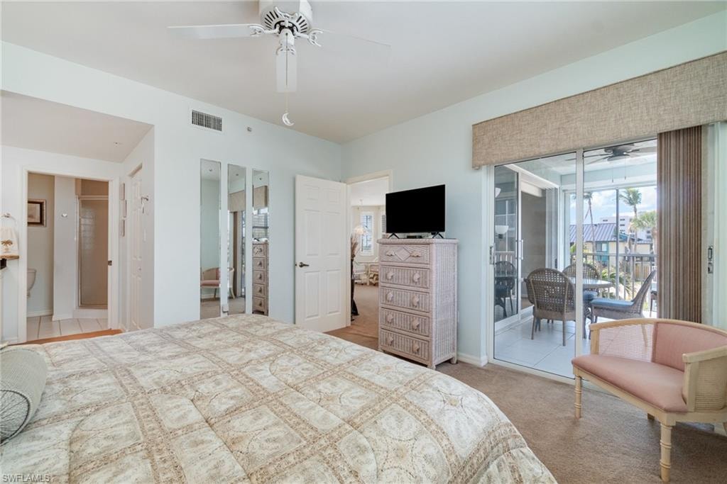 Carpeted bedroom with ceiling fan and access to outside