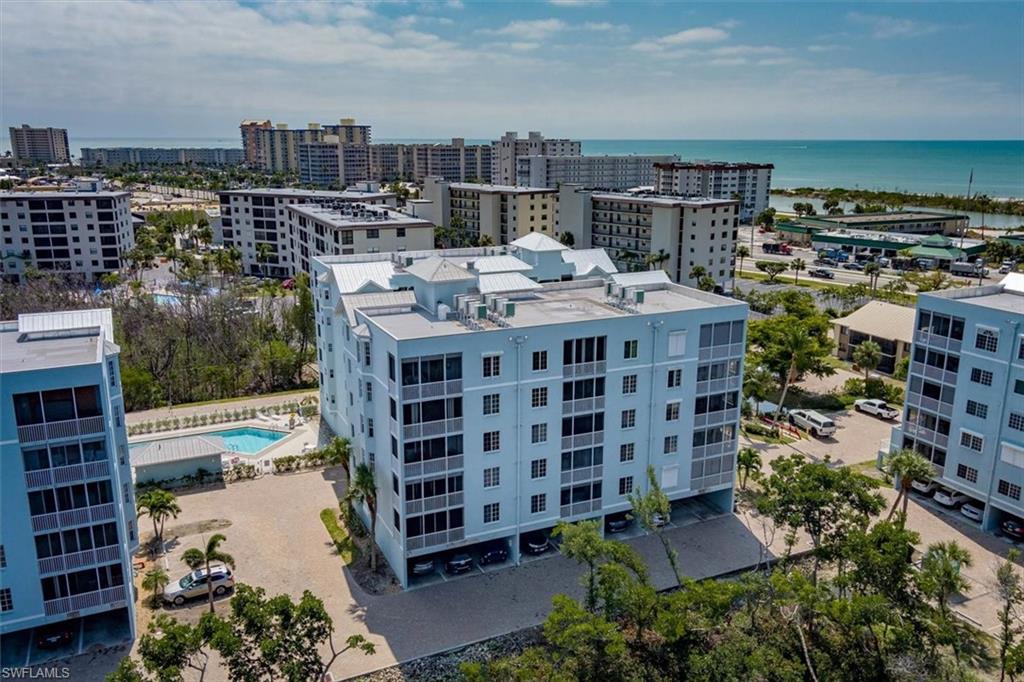 Birds eye view of property with a water view