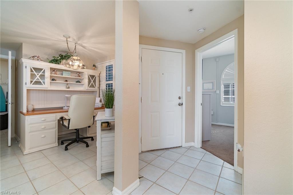 Office area with light tile patterned floors
