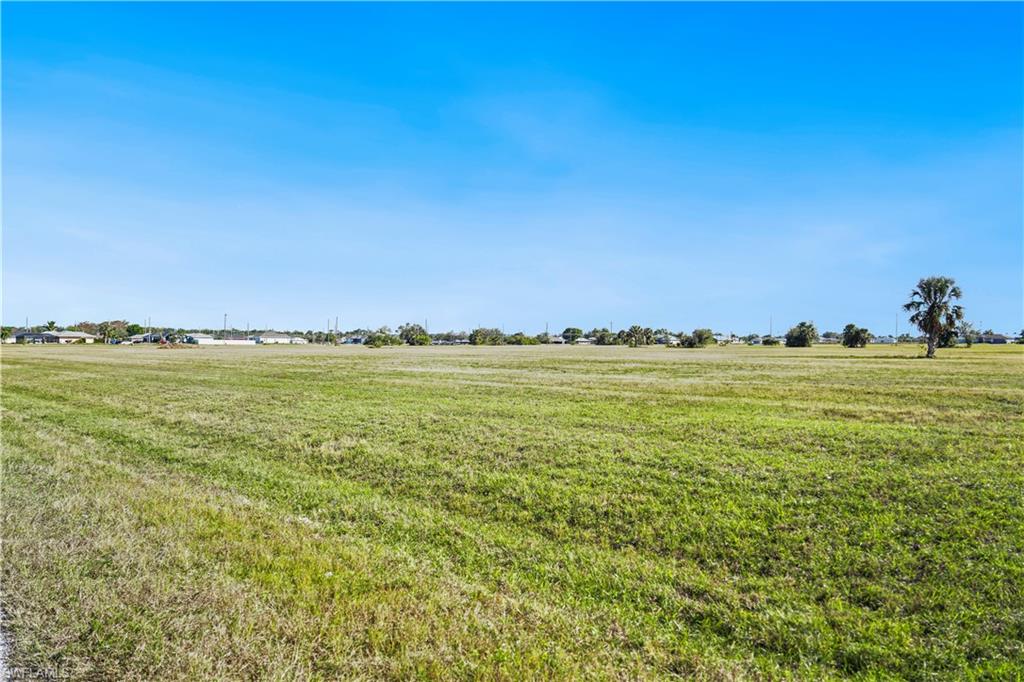 View of yard with a rural view