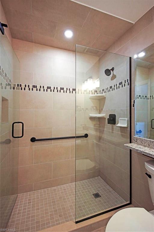 Bathroom with an enclosed shower and toilet