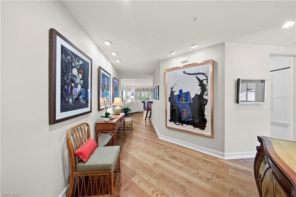 Hallway with light hardwood / wood-style floors