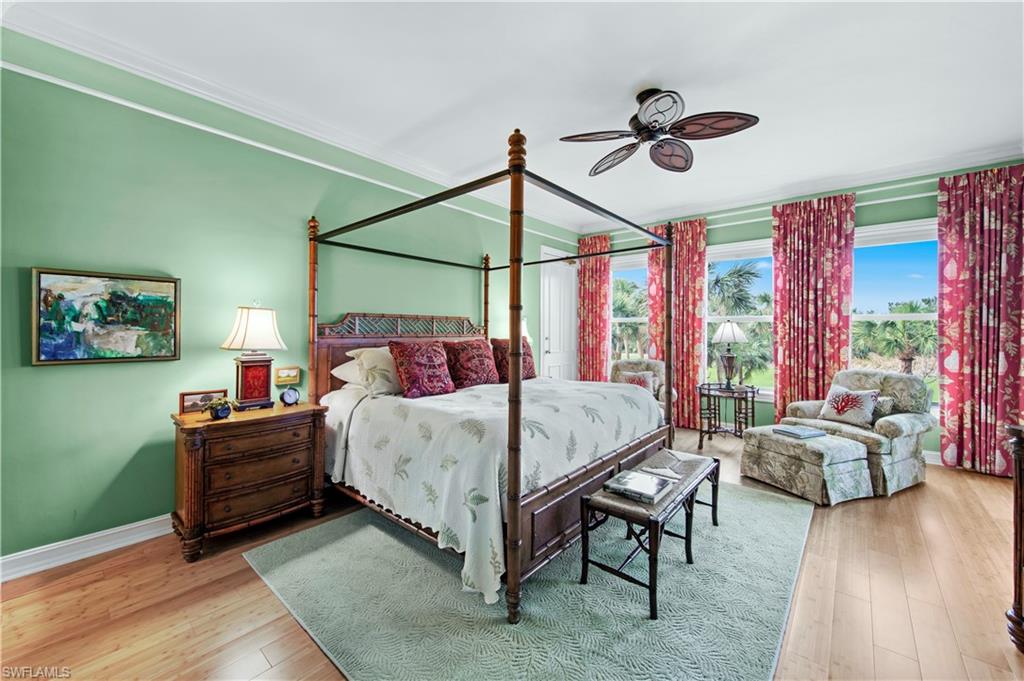 Bedroom with ceiling fan and light hardwood / wood-style flooring
