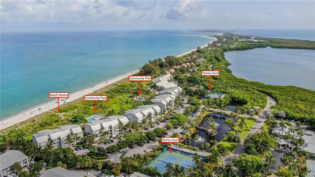 Bird's eye view with a water view and a beach view