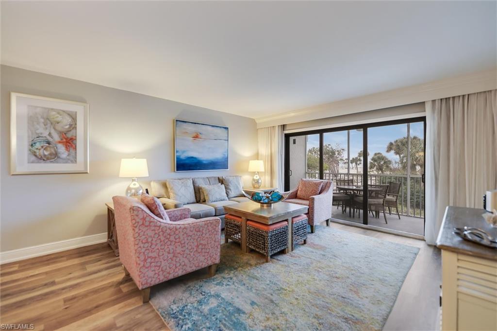 Living room with hardwood / wood-style flooring