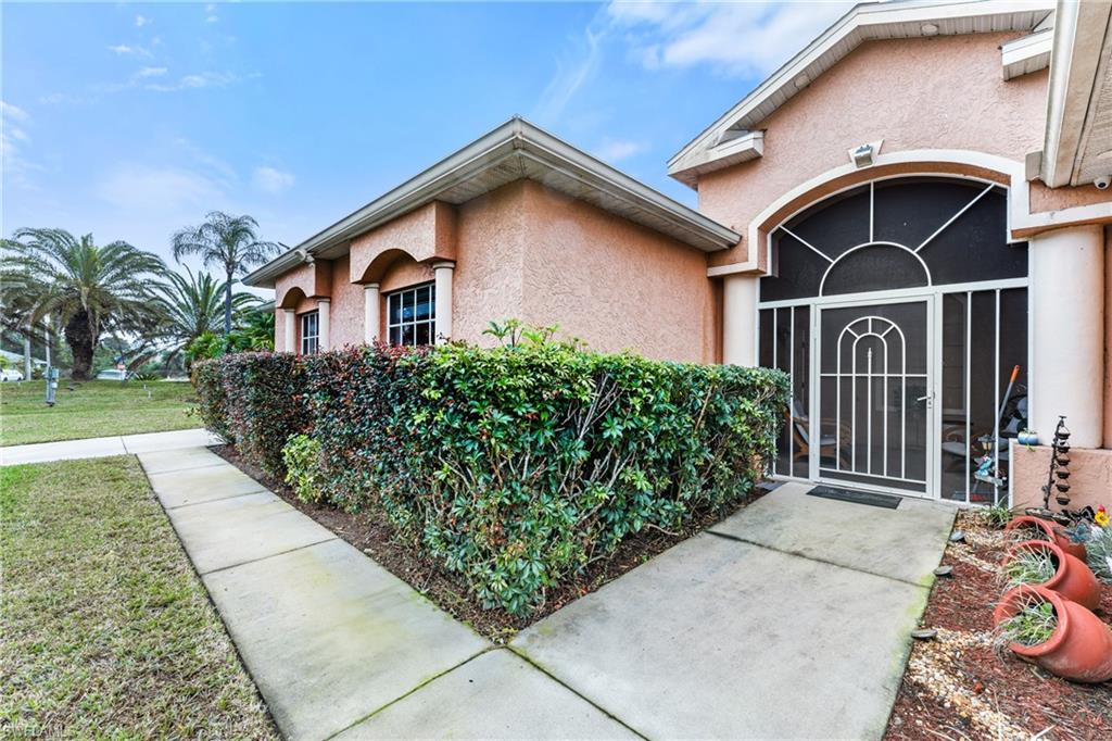 Property entrance featuring a lawn