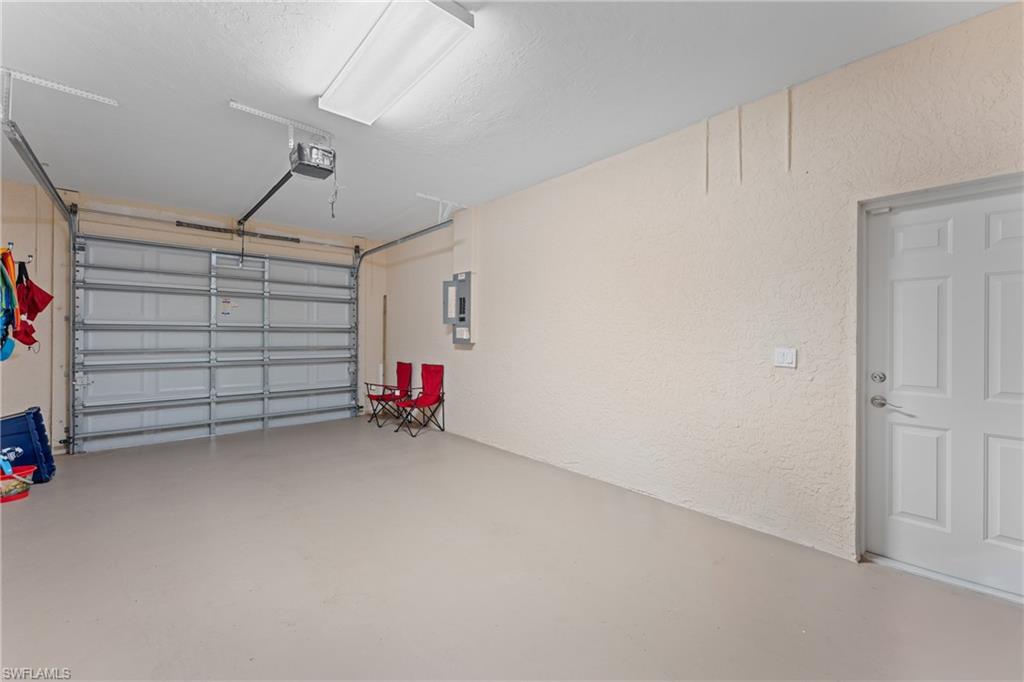 Garage featuring a garage door opener