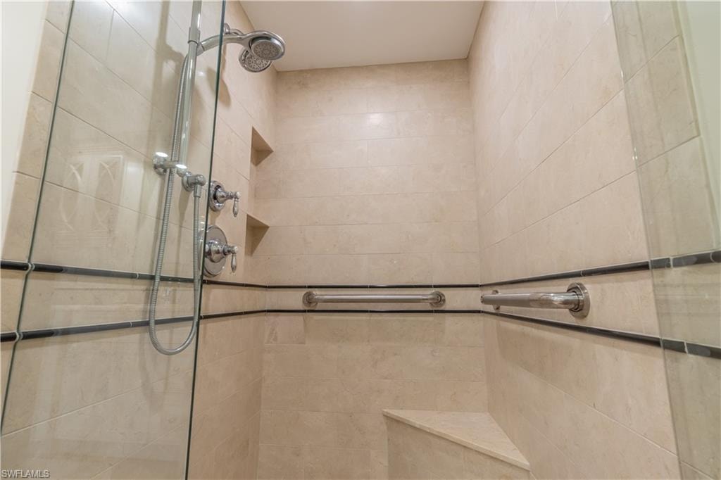 Primary Bathroom with a tile shower