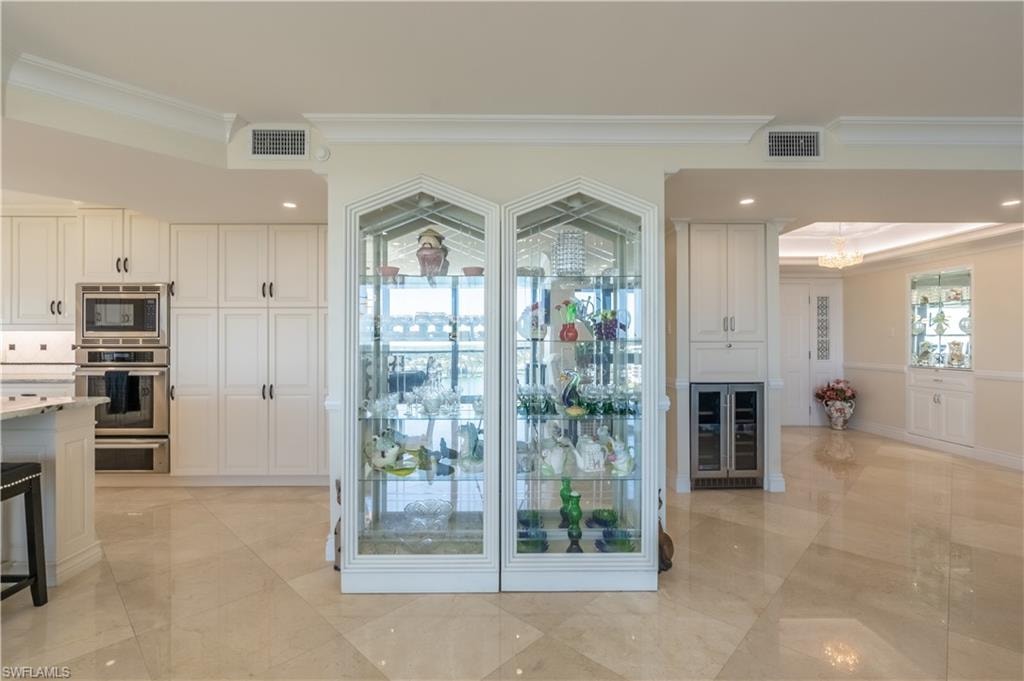 Entryway with ornamental molding and beverage cooler