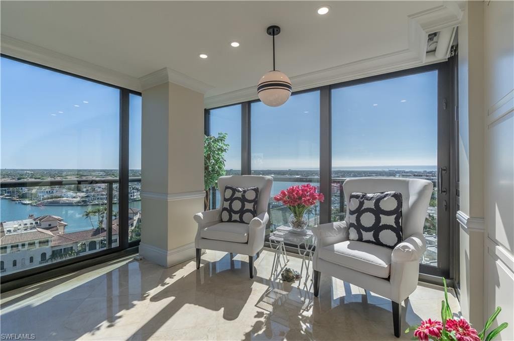 Sunroom / solarium with a water view