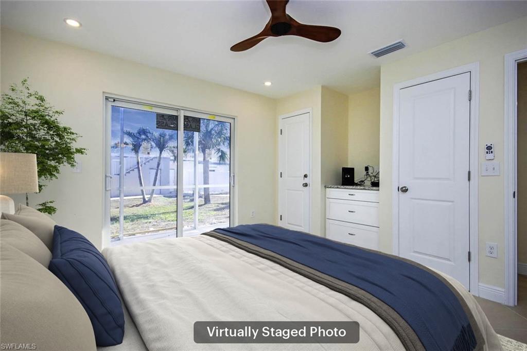 Bedroom featuring access to exterior and ceiling fan