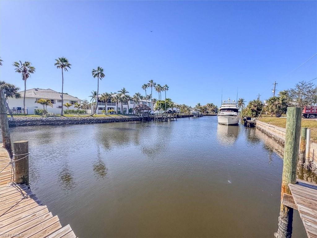 Dock area featuring a water view