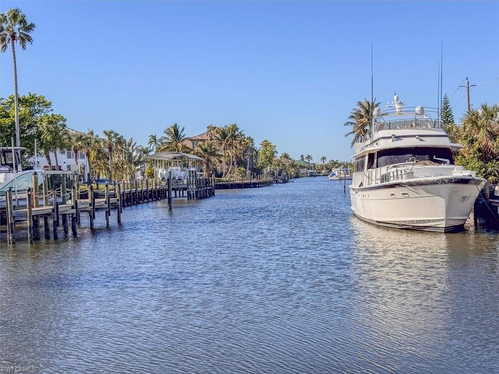 Property view of water with a dock