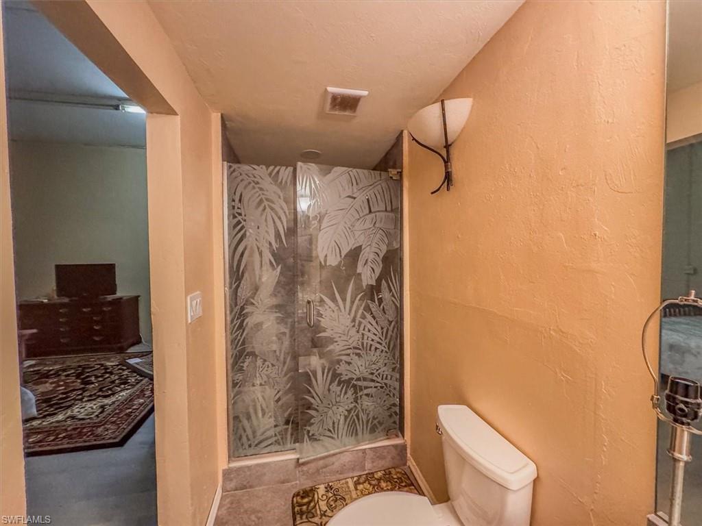 Bathroom with walk in shower and toilet