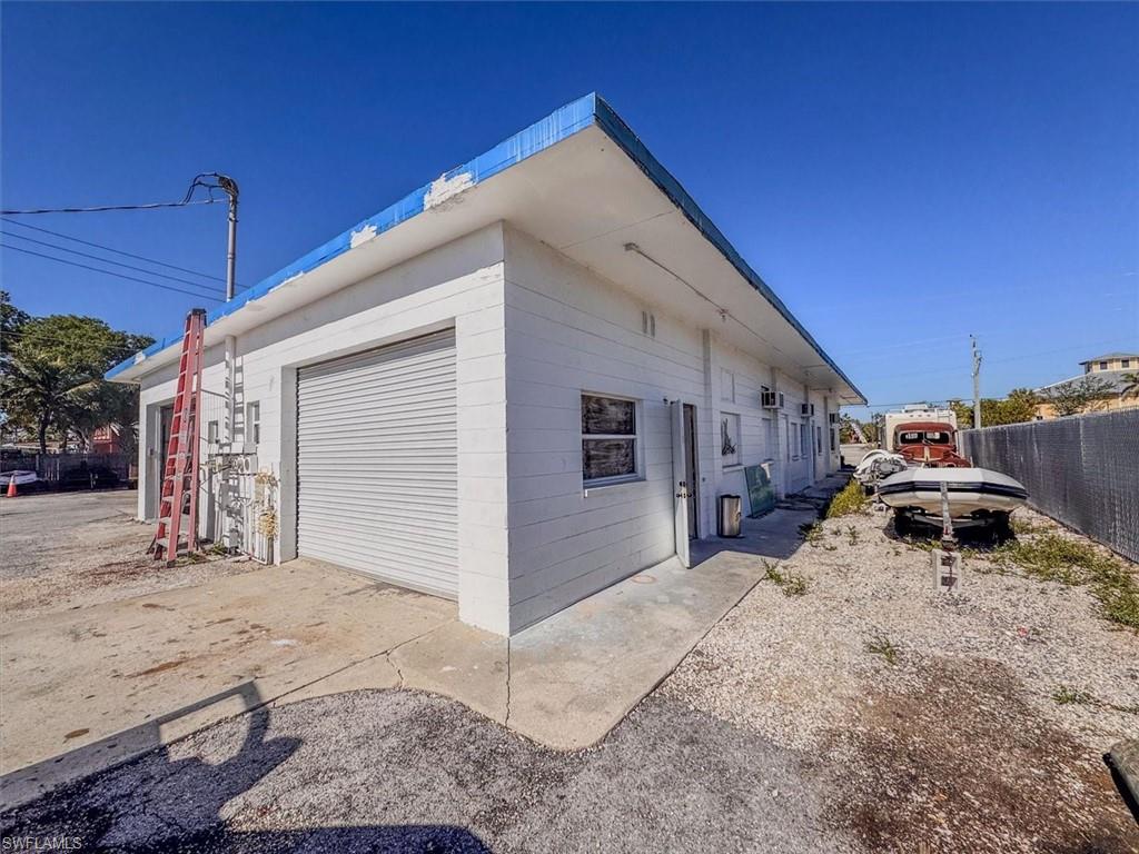 View of property exterior featuring a garage