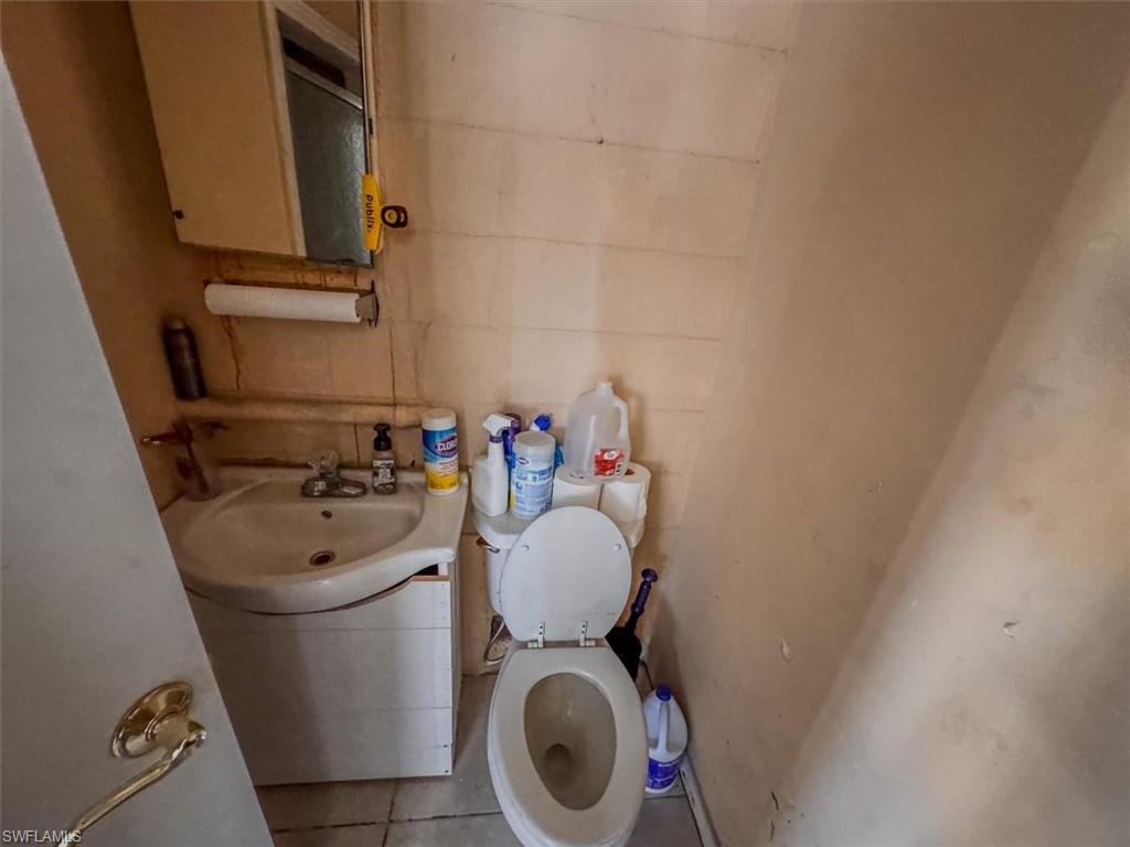 Retail/Office Bathroom featuring sink and toilet