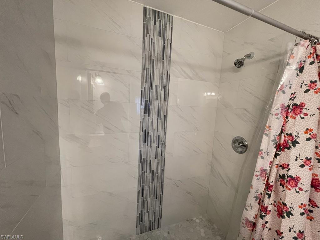 Bathroom with a shower with curtain