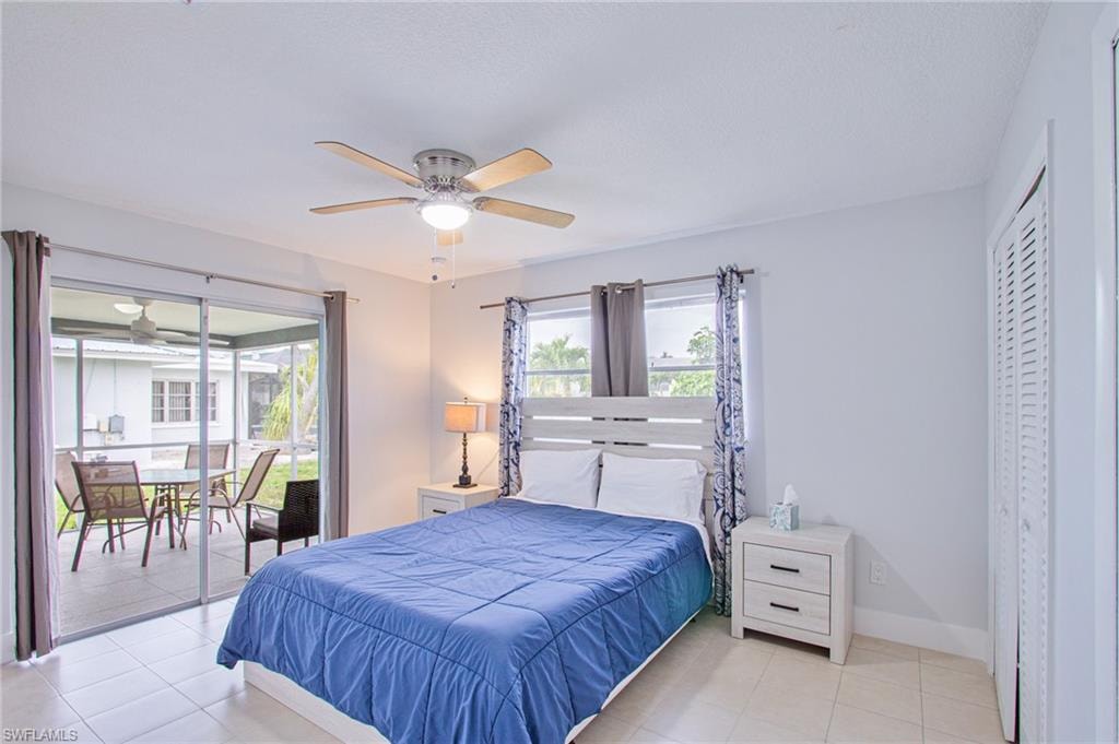 Bedroom featuring ceiling fan and light tile patterned flooring