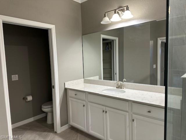 Master Bathroom featuring tile patterned flooring, vanity, and toilet