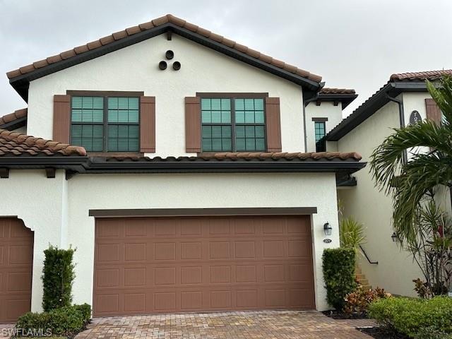 View of front of home featuring a garage